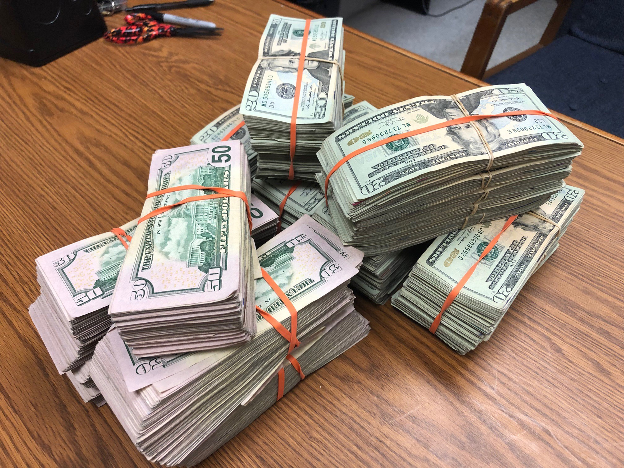 Nuñez described finding a "foot-long stack" of cash next to the ATM. (Courtesy Albuquerque Police Department)