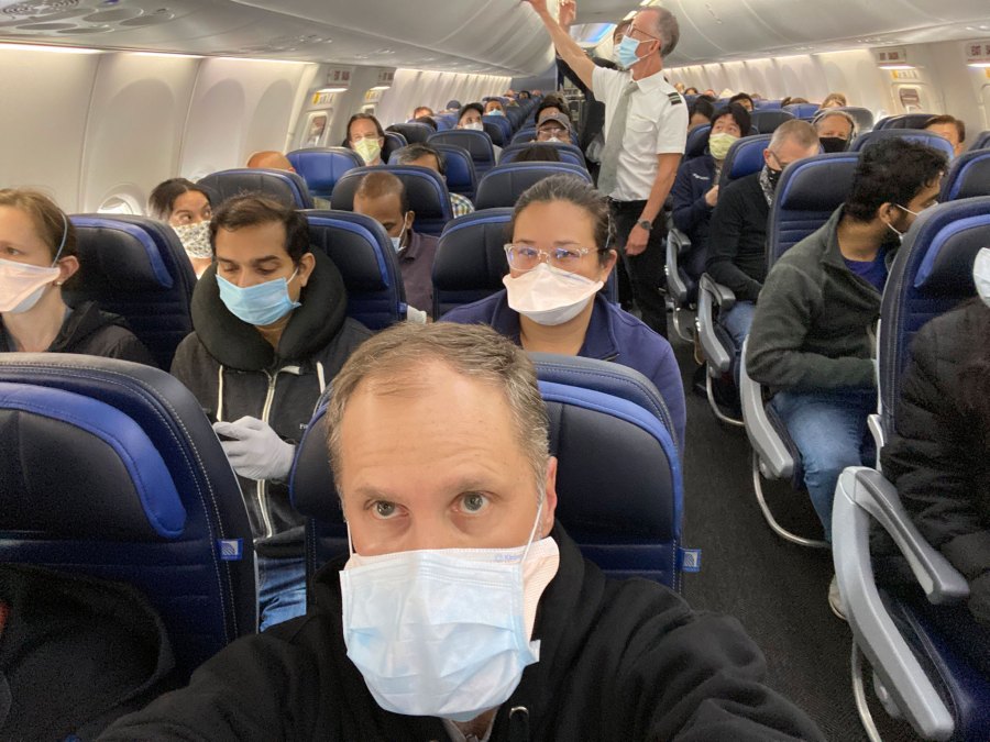 Ethan Weiss, a doctor who had been working in New York City hospitals, shared a photo over the weekend of his United flight. (CNN)