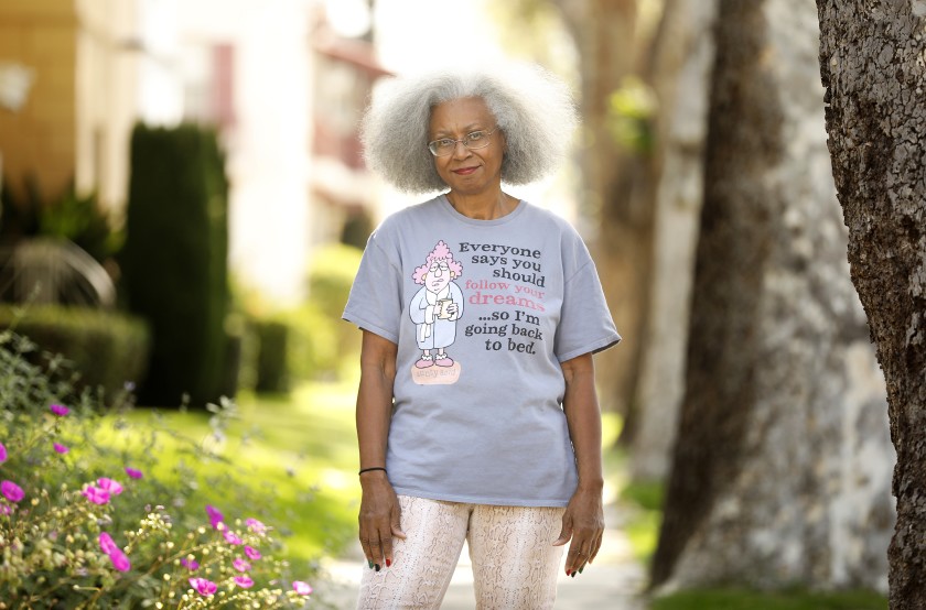 Jacquelyn Temple stands outside her home in Leimert Park in 2020. (Christina House / Los Angeles Times)