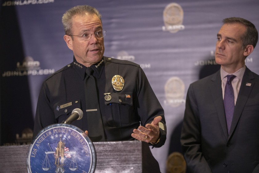 Mayor Eric Garcetti and LAPD Chief Michel Moore appear at a briefing in 2019. (Allen J. Schaben / Los Angeles Times)