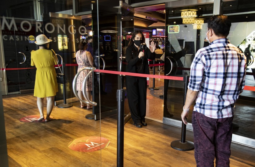 Patrons get their temperatures taken upon entering Morongo Casino, which reopened for the first time on May 22, 2020 since closing on March 17, 2020 because of the coronavirus pandemic. (Gina Ferazzi/Los Angeles Times)