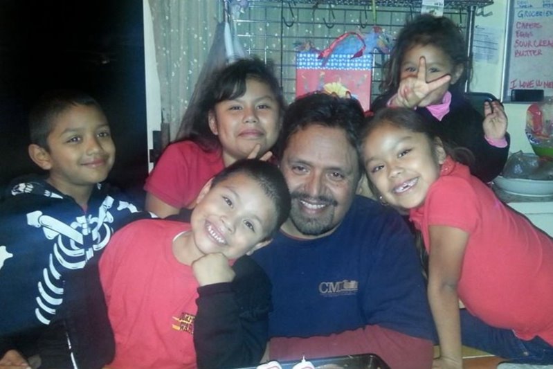 Rey Mendoza is seen with his grandchildren in a photo posted to GoFundMe on April 17, 2020.