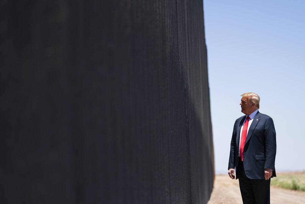 In this June 23, 2020, file photo, President Donald Trump tours a section of the border wall in San Luis, Ariz. (AP Photo/Evan Vucci, File)