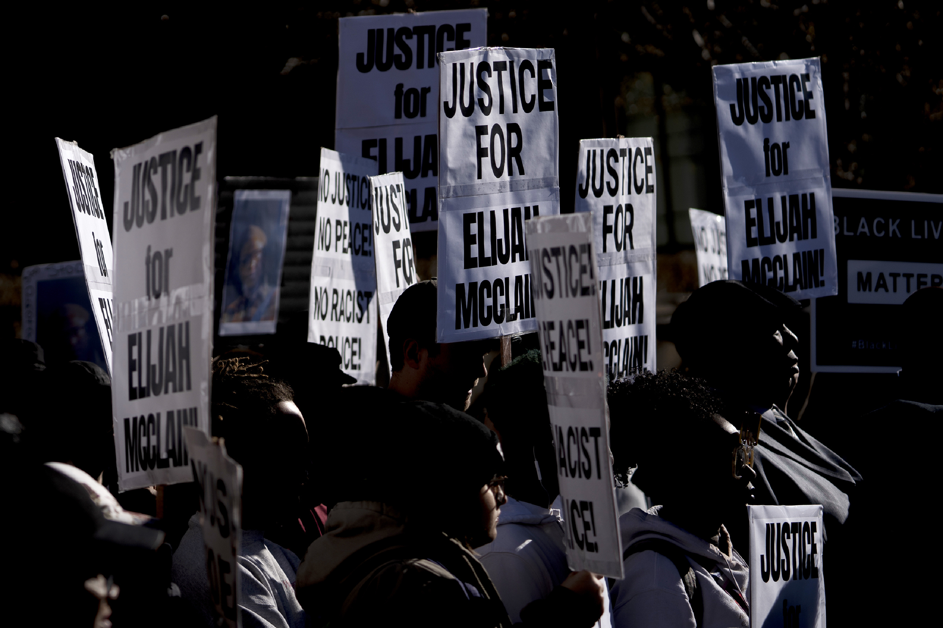 In this Nov. 23, 2019, file photo, demonstrators gather for a press conference at the Aurora Municipal Center after the police department released the body camera footage of Elijah McClain, who died after being stopped by three Aurora officers in August 2019. (Philip B. Poston/Sentinel Colorado via AP,File)