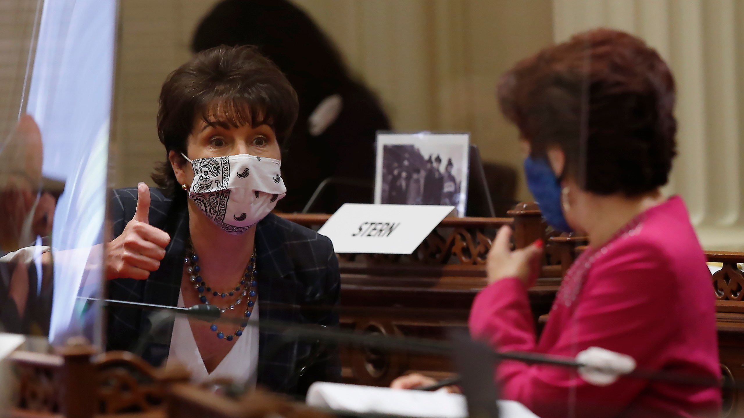 State Sen. Connie Leyva, D-Chino, left, gives a thumbs up as she talks with Sen. Anna Caballero, D-Salinas, at the Capitol, in Sacramento on June 25, 2020. (AP Photo/Rich Pedroncelli)