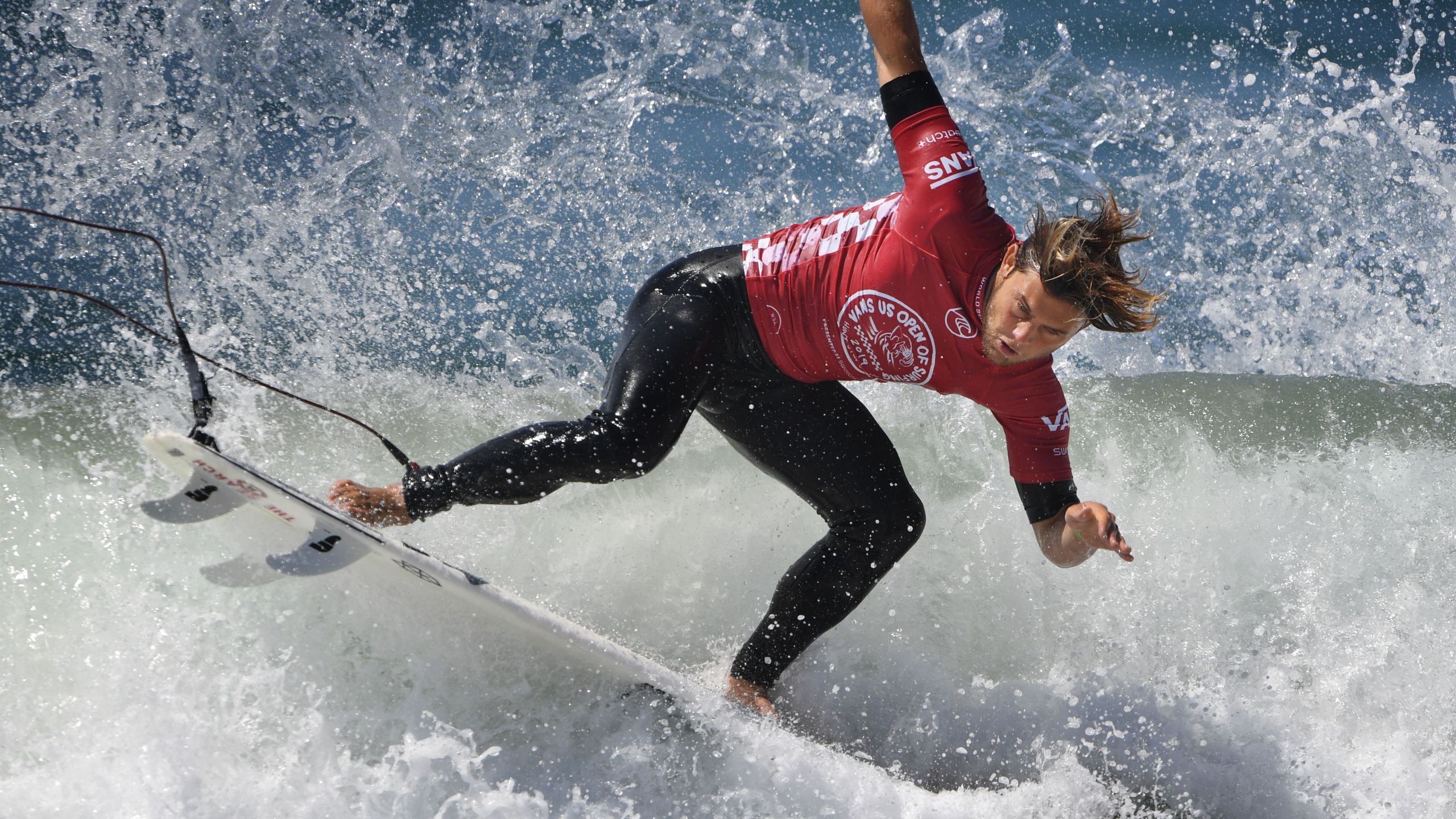 Conner Coffin of the U.S. lands after a rotation during round four of the Vans U.S. Open of Surfing held at Huntington Beach on Aug. 2, 2019. (MARK RALSTON/AFP via Getty Images)