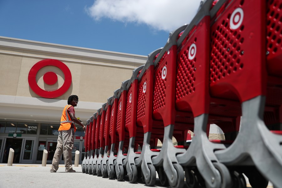 A Target store employee collects shopping carts to bring back into the store on August 21, 2019 in Pembroke Pines, Florida. (Joe Raedle/Getty Images)