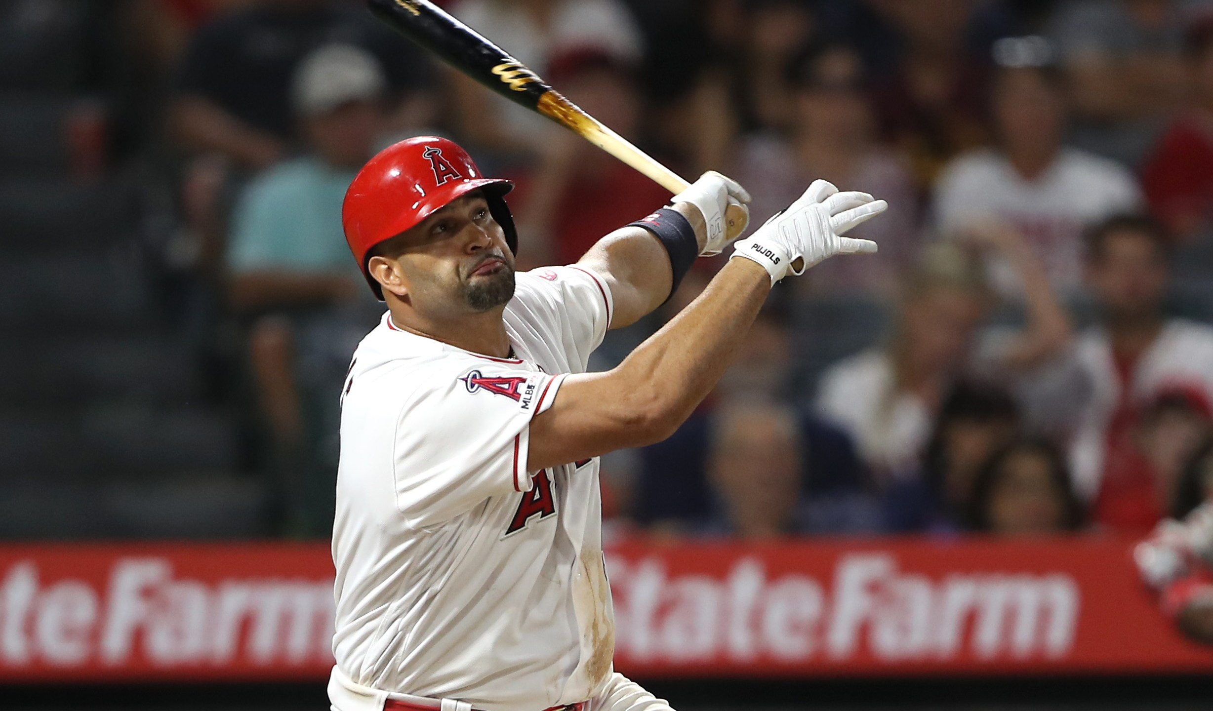 Albert Pujols of the Los Angeles Angels of Anaheim connects for a three-run homerun during the eighth inning of a game against the Boston Red Sox at Angel Stadium in Anaheim on August 31, 2019. (Sean M. Haffey/Getty Images)