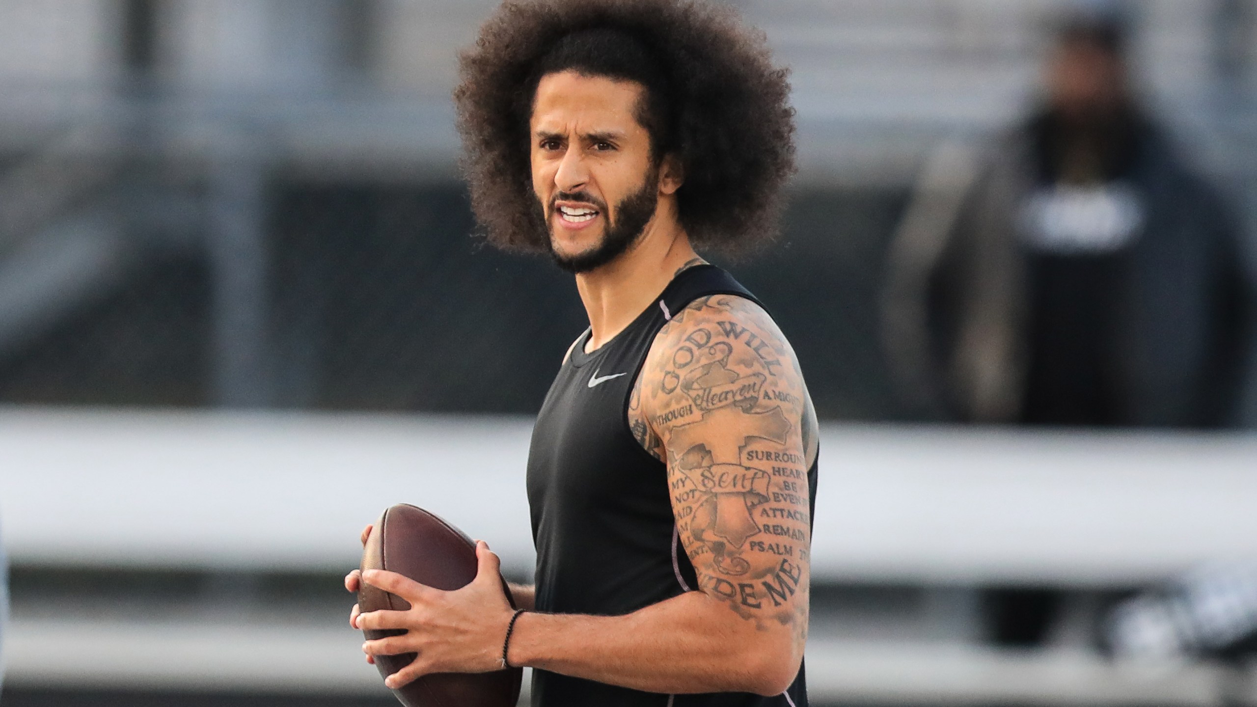 Colin Kaepernick looks to make a pass during a private NFL workout held at Charles R. Drew High School on Nov. 16, 2019 in Riverdale, Georgia. (Carmen Mandato/Getty Images)