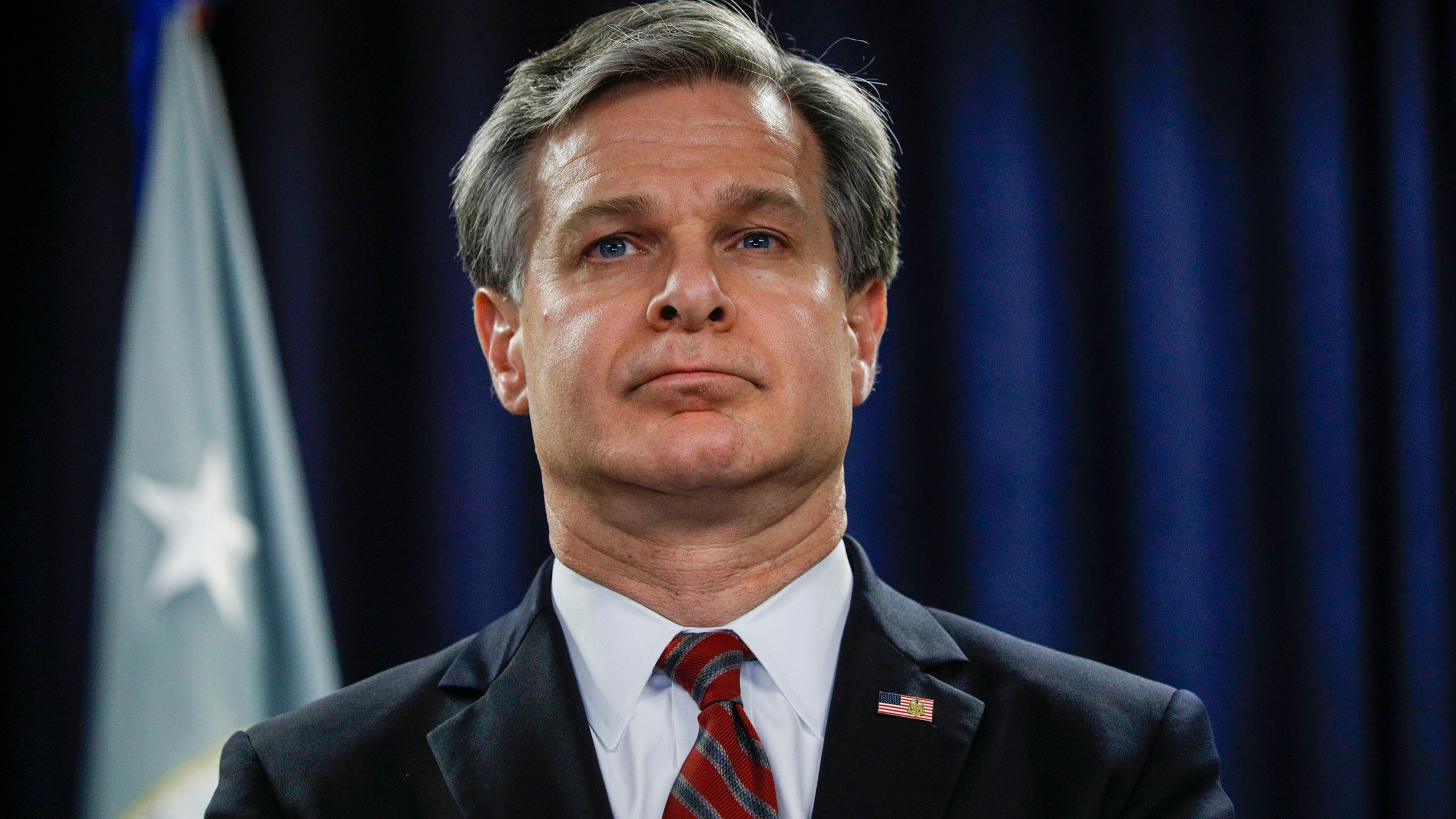 FBI Director Christopher Wray waits to speak at a news conference in Detroit on Dec. 18, 2019. (Bill Pugliano/Getty Images)