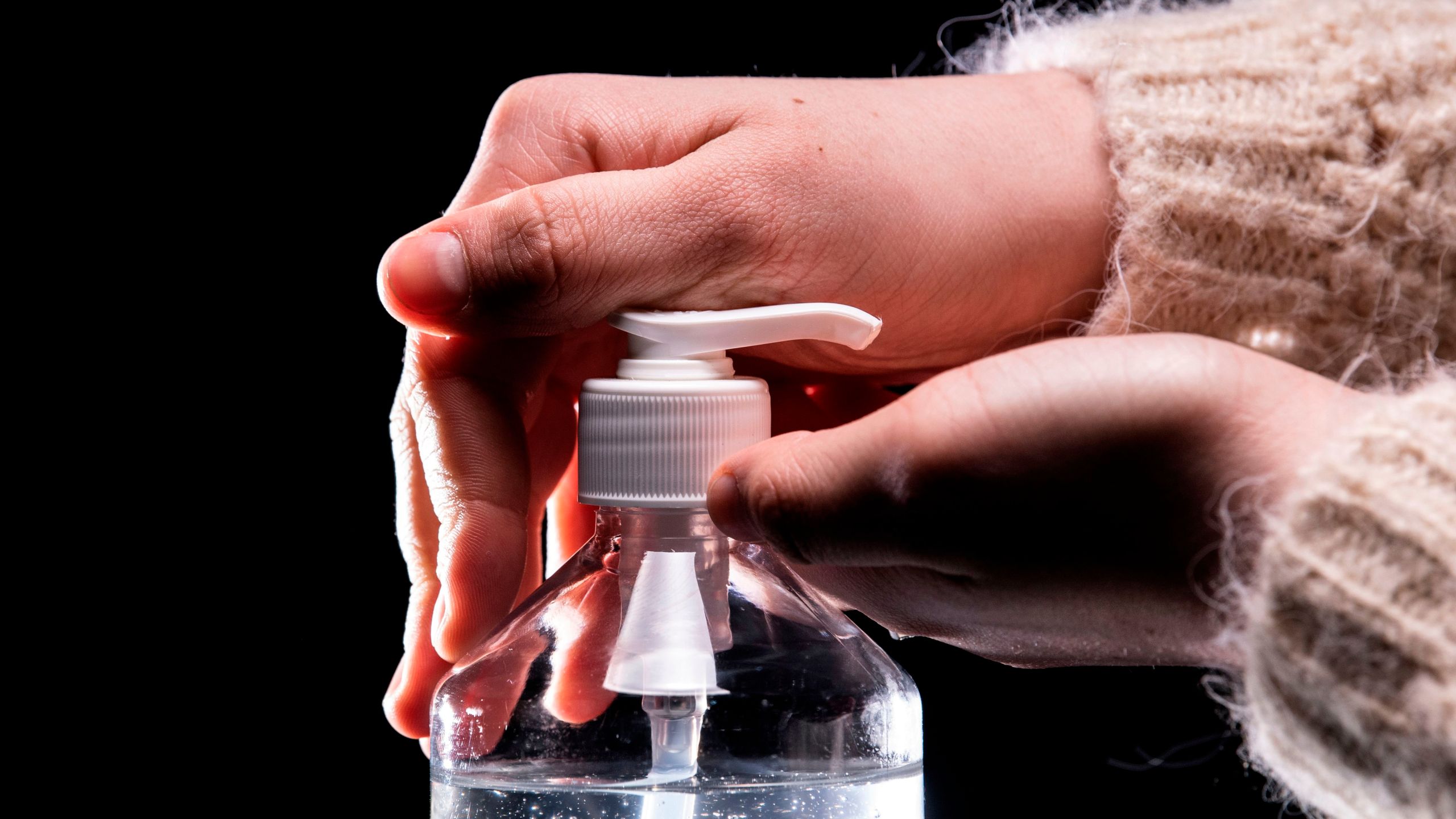 A person takes from a bottle of hydroalcoholic hand sanitizer on March 5, 2020, in Paris amid a spread of COVID-19. (LIONEL BONAVENTURE/AFP via Getty Images)