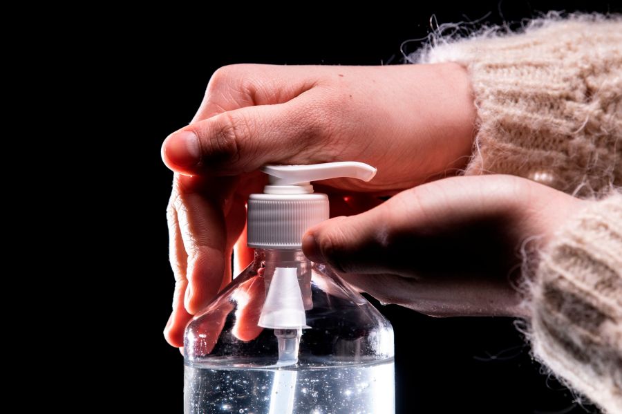 A person takes from a bottle of hydroalcoholic hand sanitizer on March 5, 2020, in Paris amid a spread of COVID-19. (LIONEL BONAVENTURE/AFP via Getty Images)