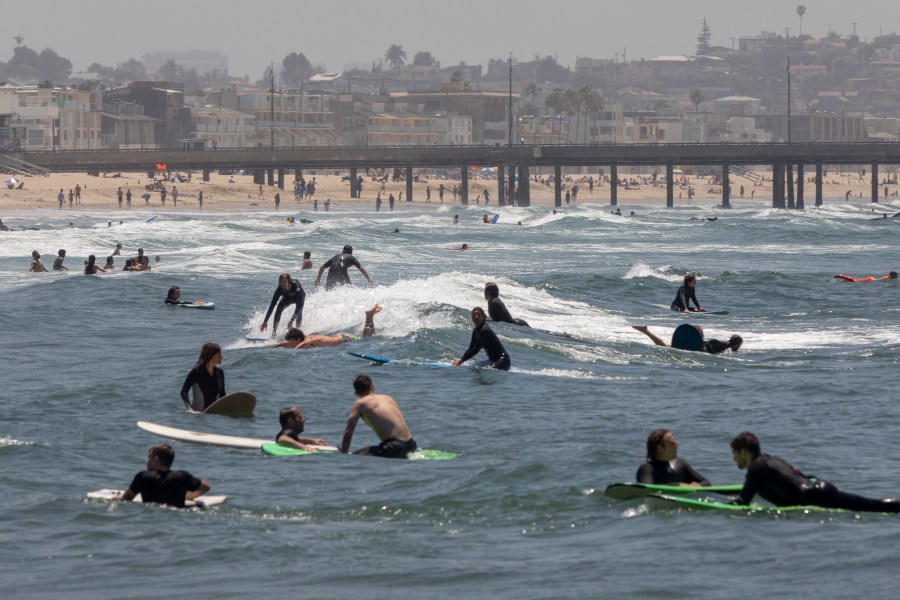 Holiday beachgoers enjoying the surf at Venice Beach. (David McNew/Getty Images)