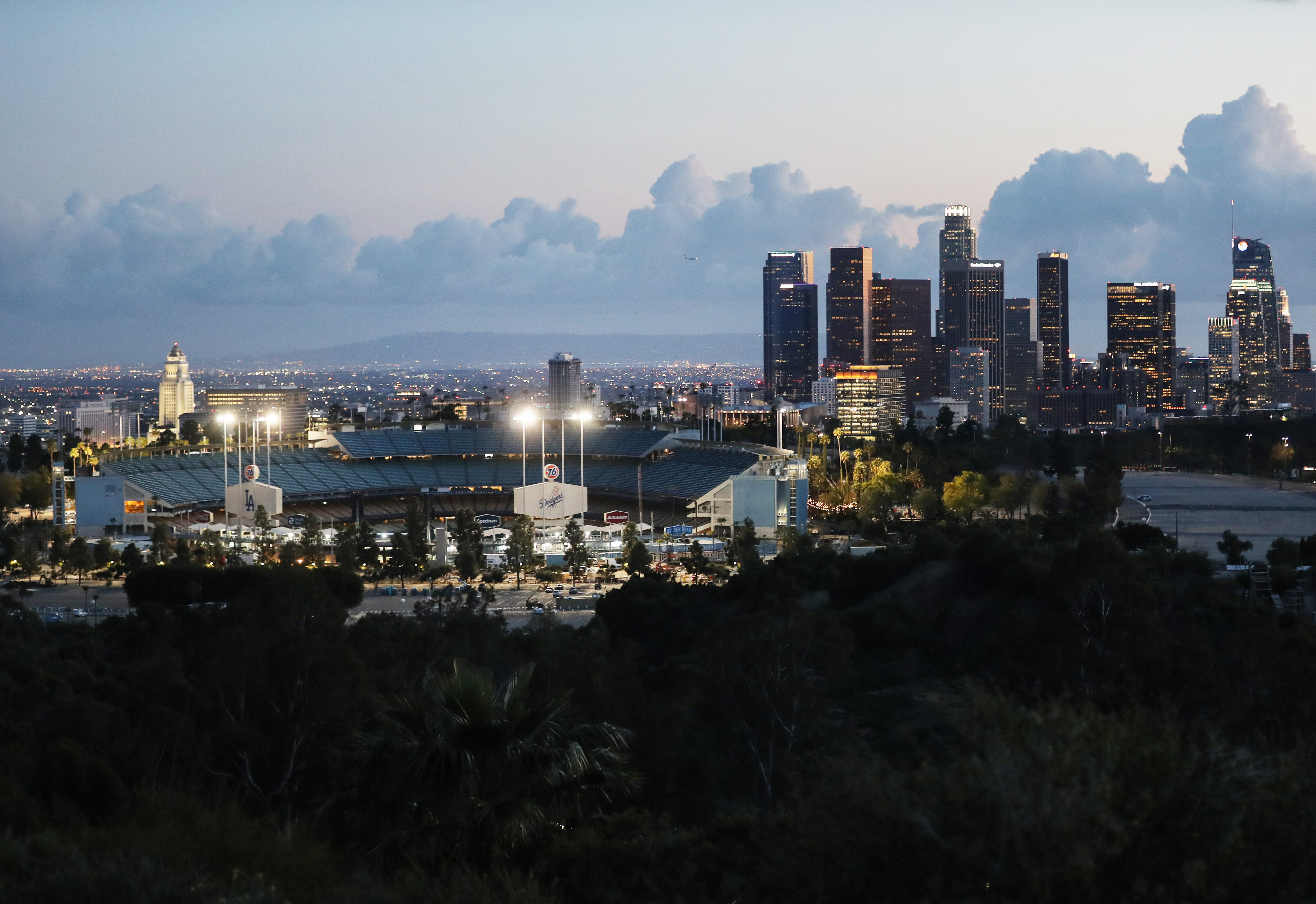 Downtown L.A. rises behind an empty Dodger Stadium on what was supposed to be Major League Baseball's Opening Day on March 26, 2020. (Mario Tama/Getty Images)