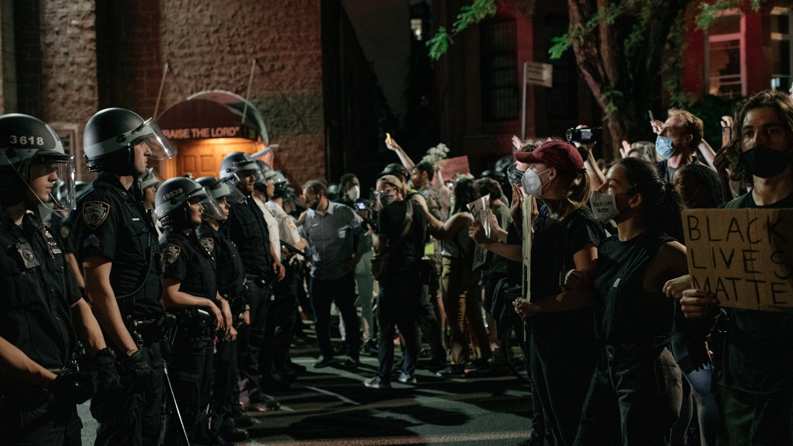 Demonstrators denouncing systemic racism in law enforcement face off with a line of NYPD officers hours after violating a citywide curfew on June 4, 2020 in New York City. (Scott Heins/Getty Images)