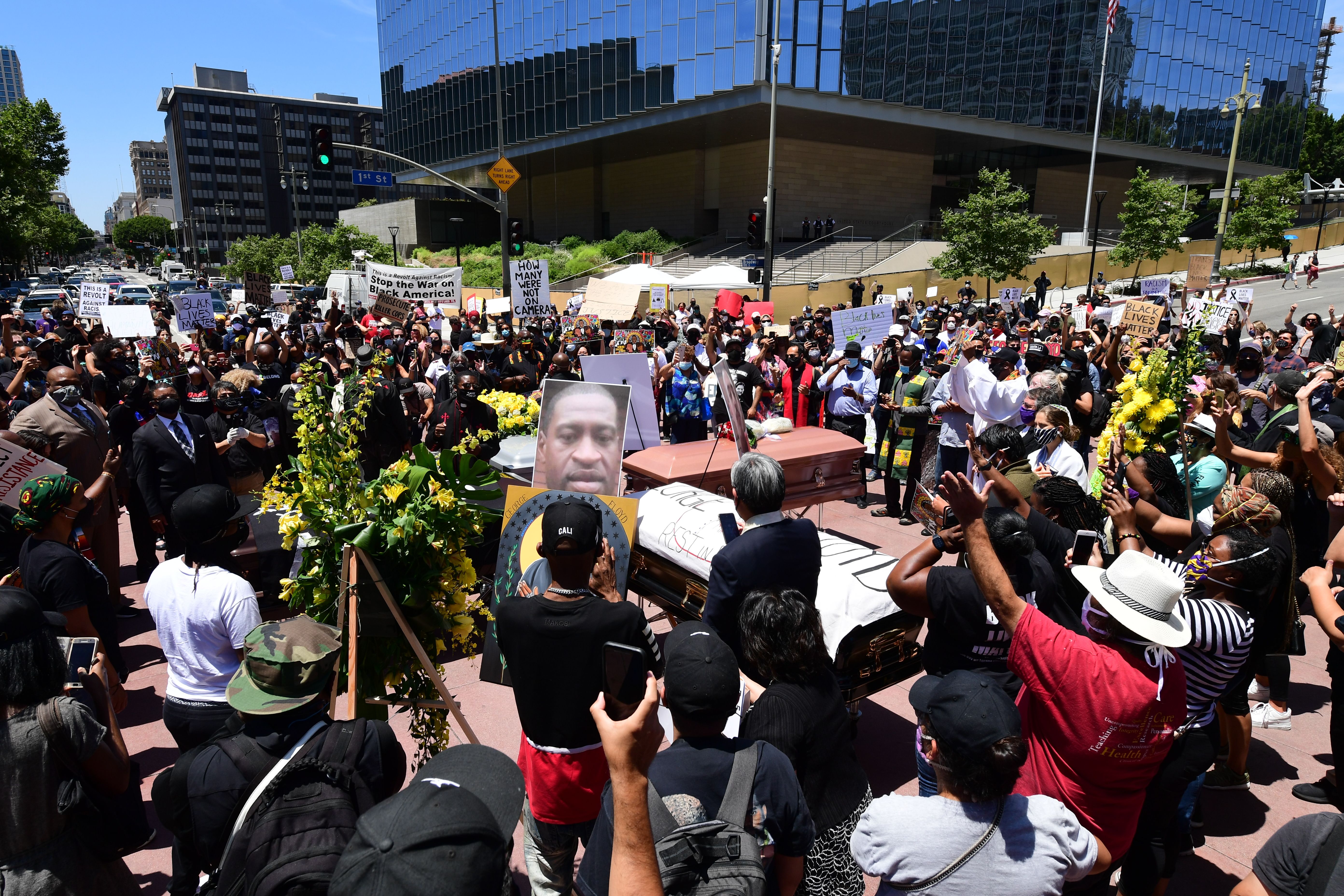 Advocates hold a memorial service honoring George Floyd in downtown Los Angeles on June 8, 2020. (FREDERIC J. BROWN/AFP via Getty Images)