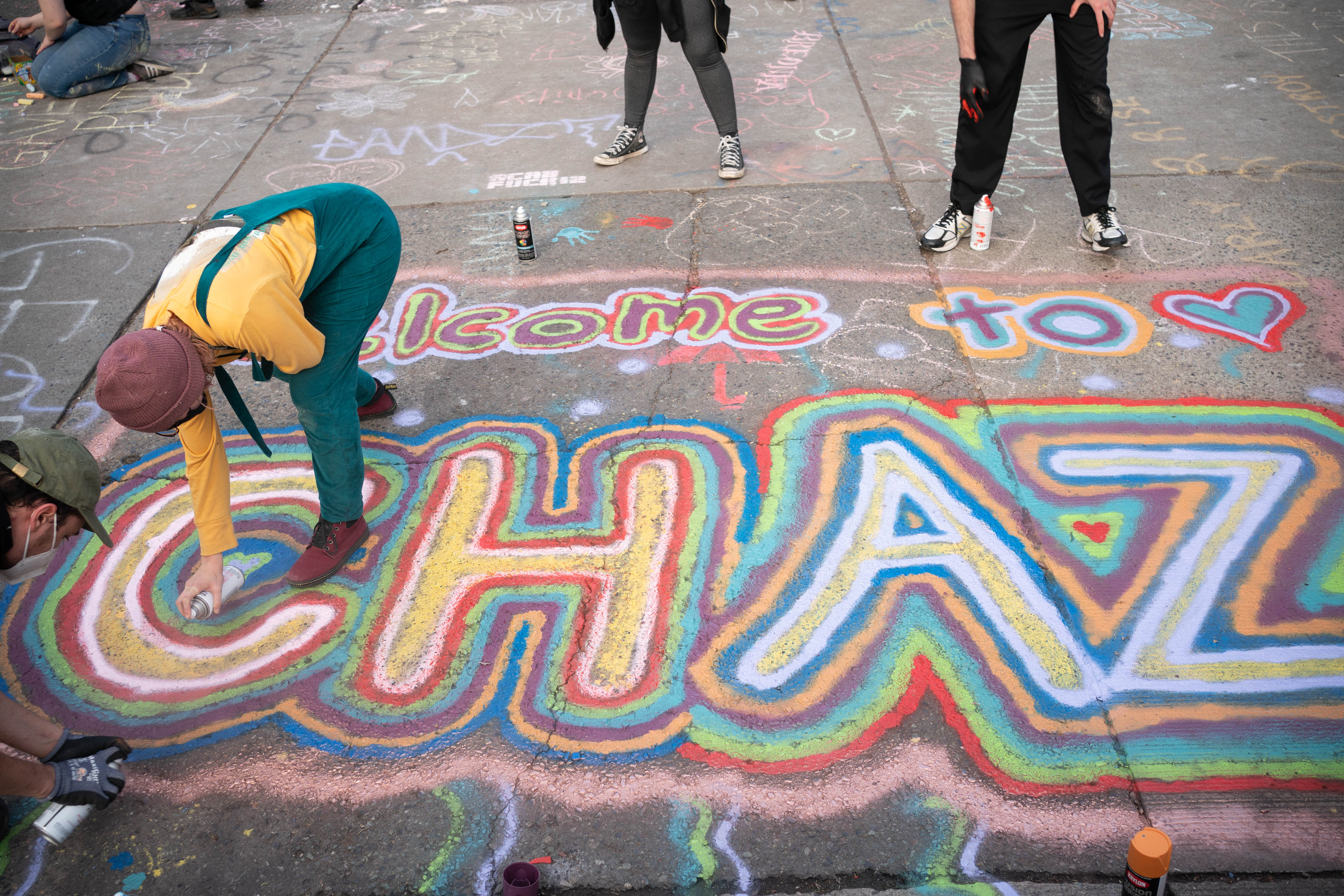 People paint an acronym for "Capitol Hill Autonomous Zone" near the Seattle Police Department's East Precinct on June 10, 2020. (David Ryder / Getty Images)