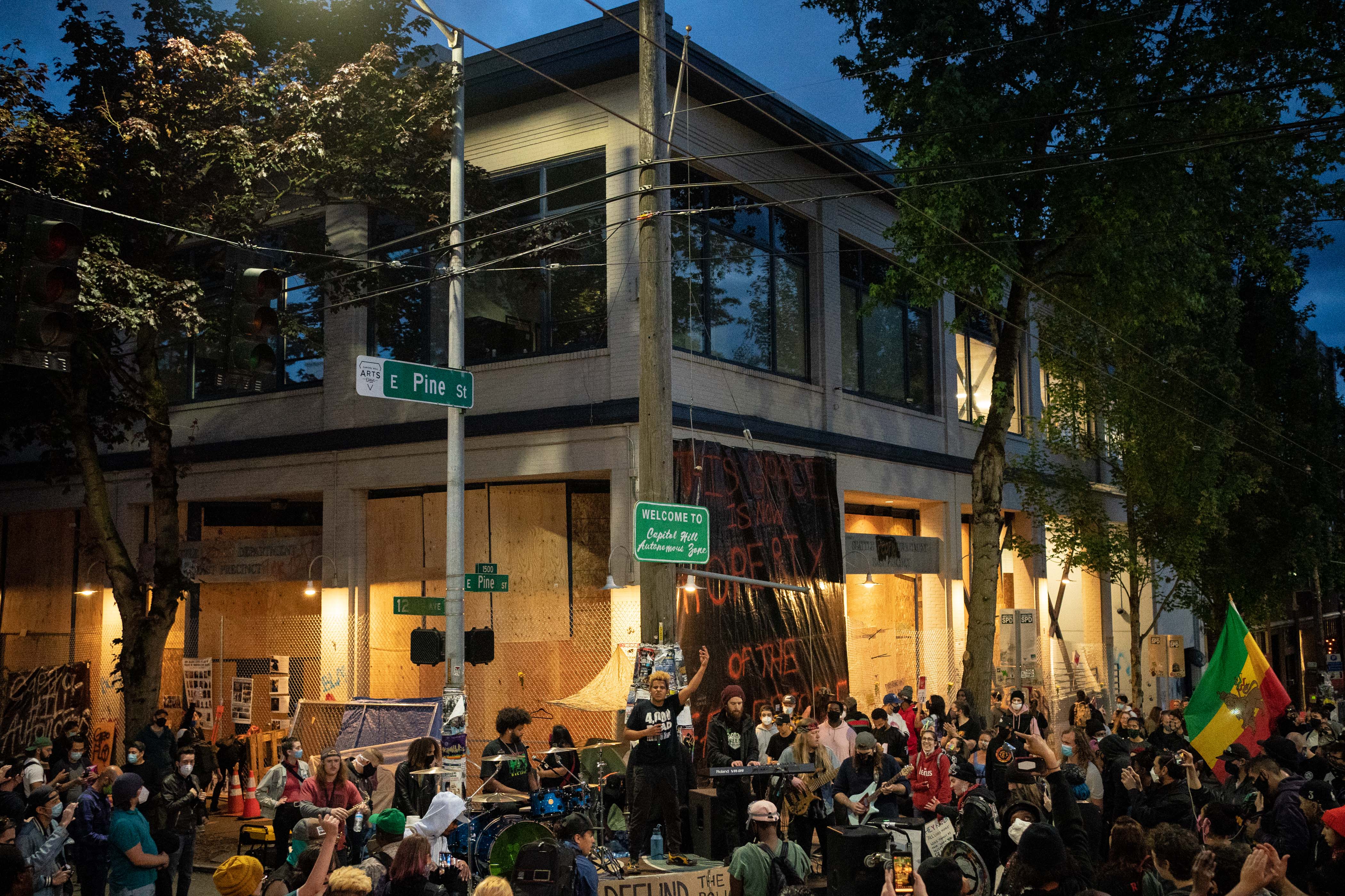 A band plays a free show in front of the Seattle Police Department's East Precinct in the so-called Capitol Hill Autonomous Zone on June 10, 2020. (David Ryder / Getty Images)