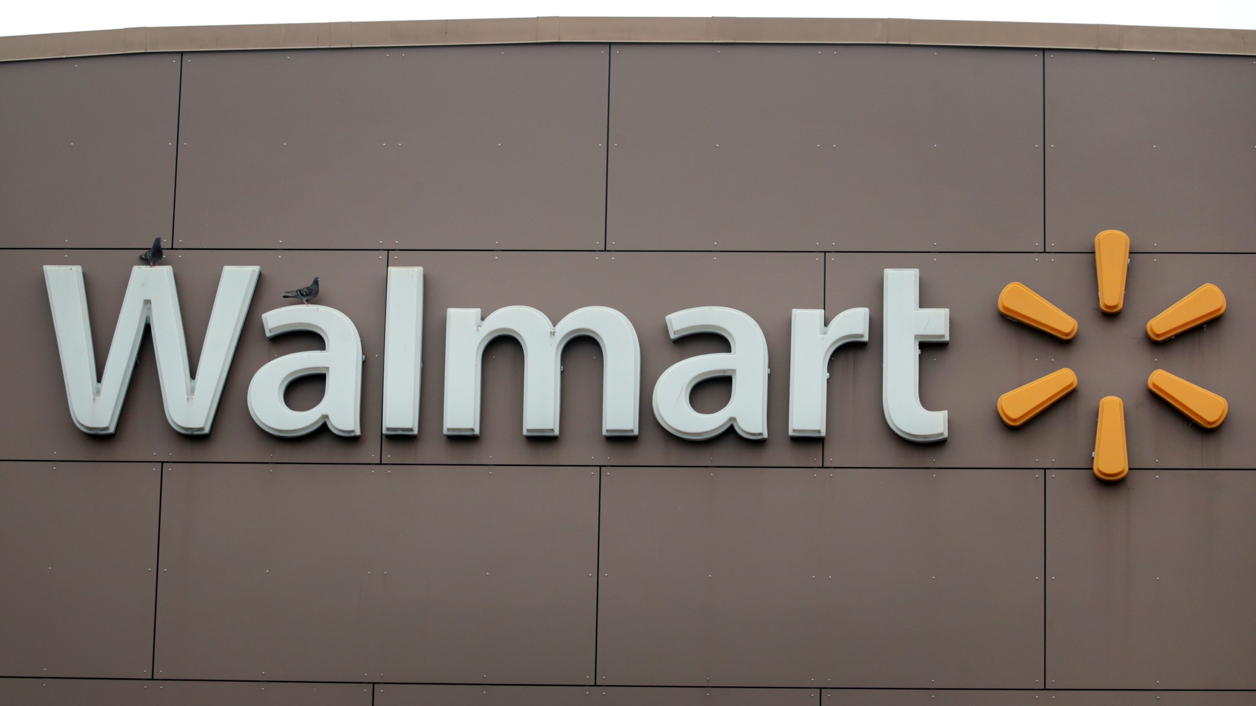 A sign hangs outside of a Walmart store on May 19, 2020 in Chicago, Illinois. (Scott Olson/Getty Images)