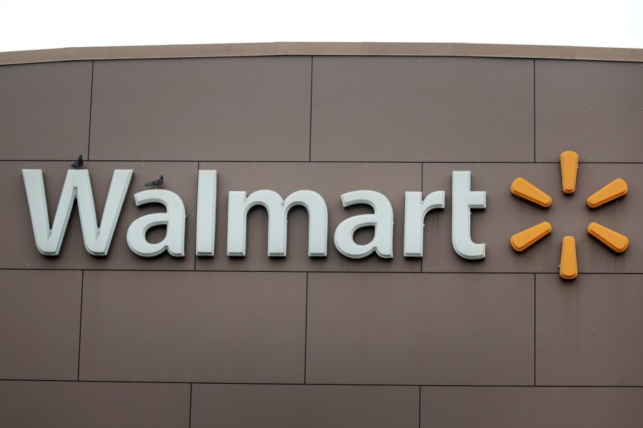 A sign hangs outside of a Walmart store on May 19, 2020 in Chicago, Illinois. (Scott Olson/Getty Images)