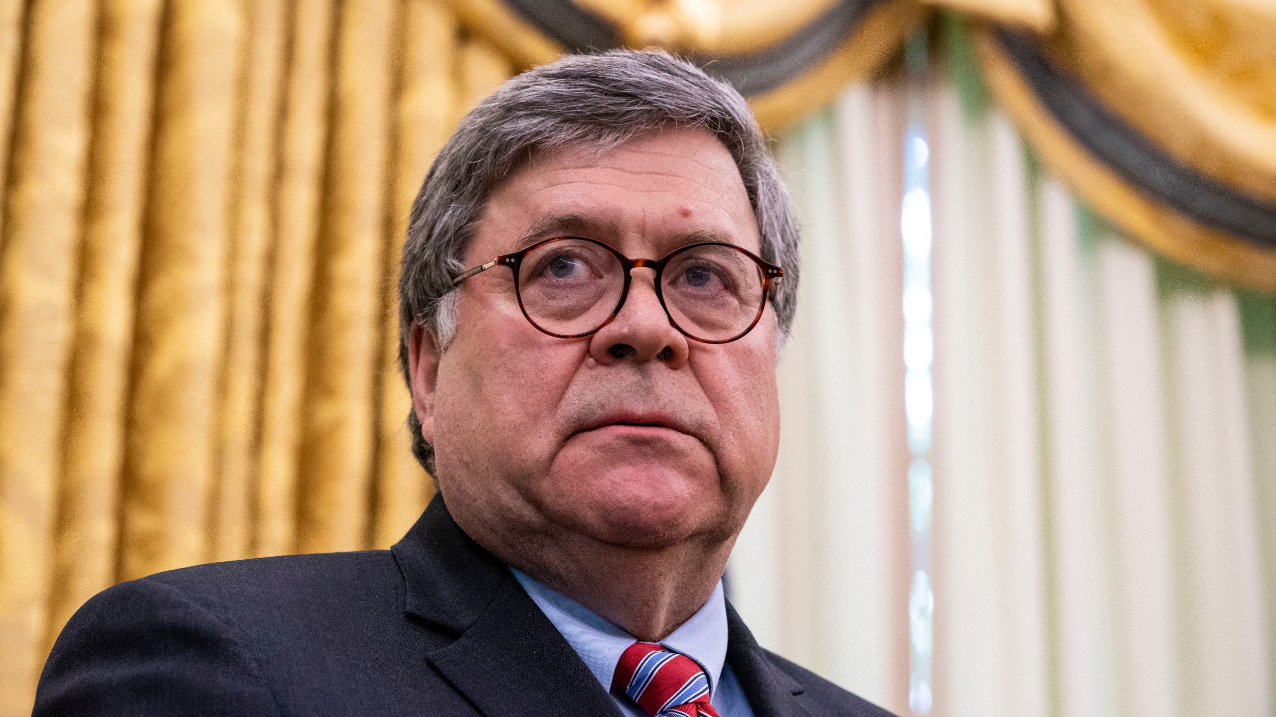 Attorney General William Barr listens as U.S. President Donald Trump speaks in the Oval Office on May 28, 2020. (Doug Mills-Pool/Getty Images)