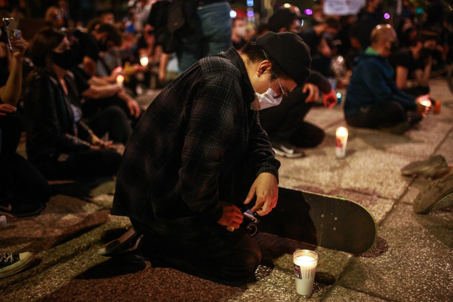 A man kneels during a protest against police brutality on June 4, 2020 in Mexico City, Mexico. (Manuel Velasquez/Getty Images)