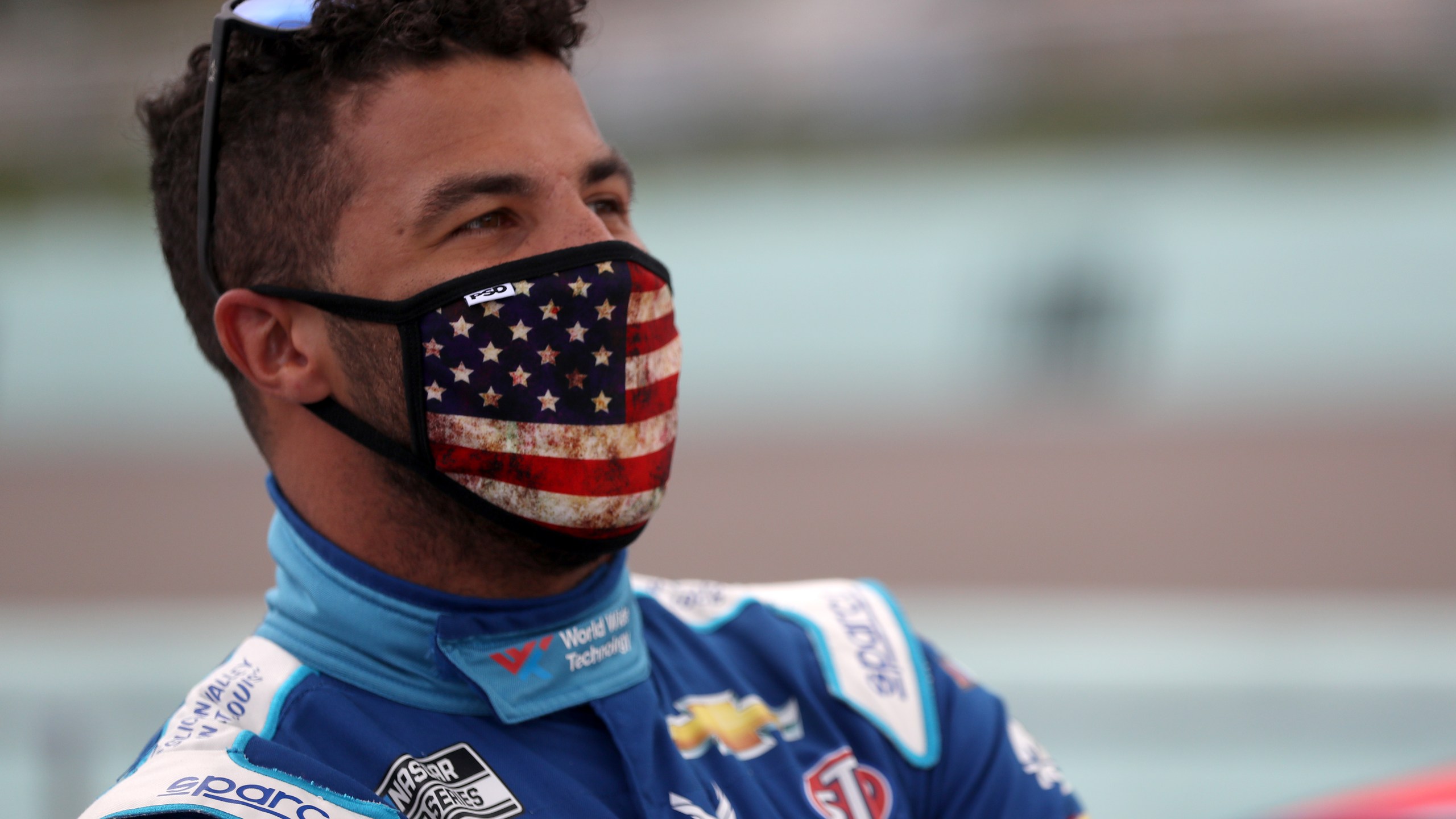 Bubba Wallace, driver of the #43 World Wide Technology Chevrolet, stands on the grid prior to the NASCAR Cup Series Dixie Vodka 400 at Homestead-Miami Speedway on June 14, 2020 ,in Homestead, Florida. (Chris Graythen/Getty Images)