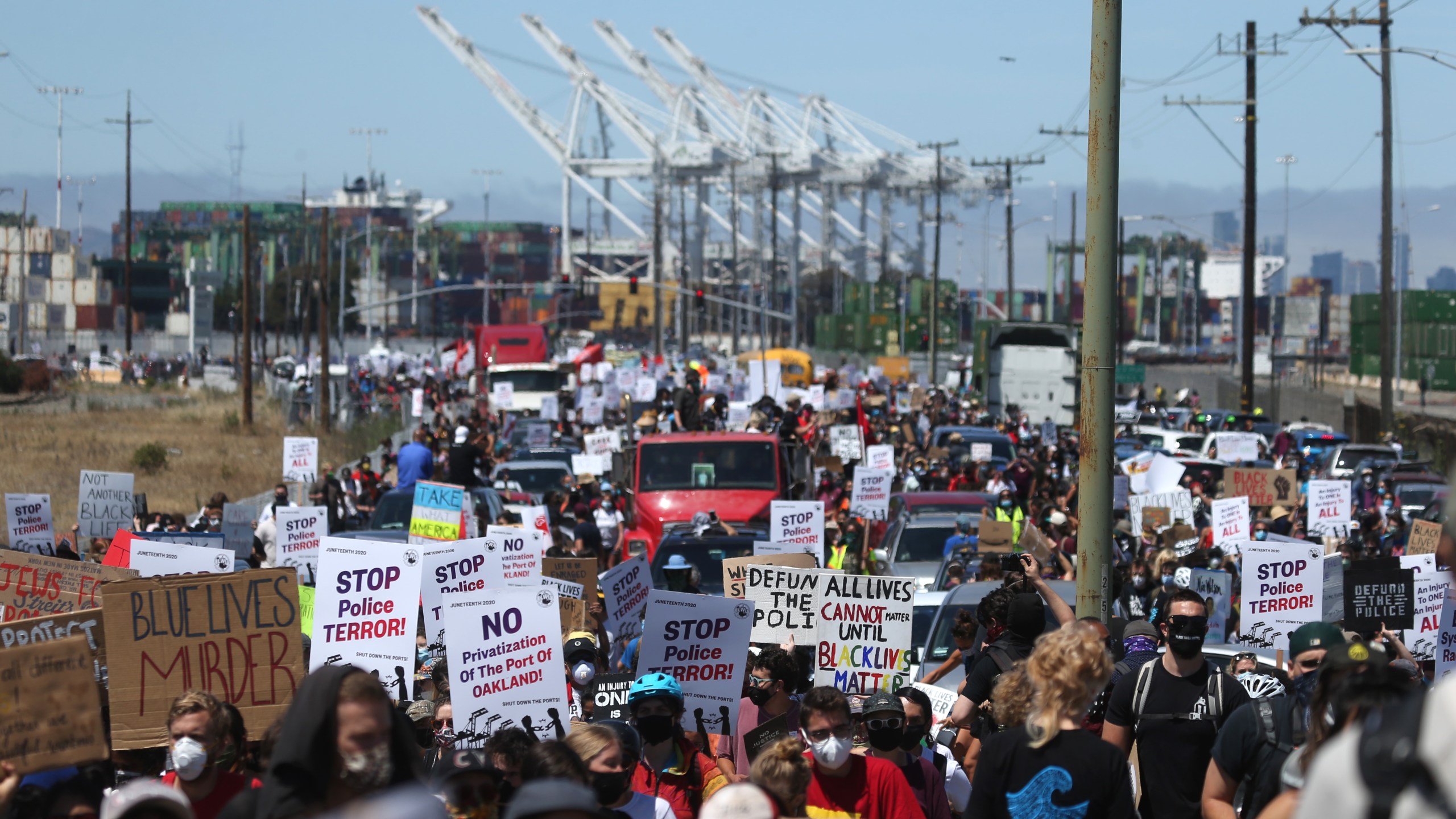 Thousands of protesters march towards downtown Oakland during a Juneteenth rally at the Port of Oakland on June 19, 2020. (Justin Sullivan / Getty Images)