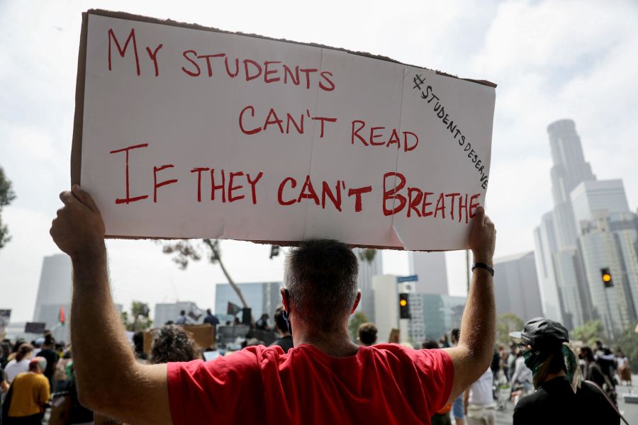 Black Lives Matter-Los Angeles supporters protest outside the Unified School District headquarters calling on the board of education to defund school police on June 23, 2020 in Los Angeles. (Mario Tama/Getty Images)