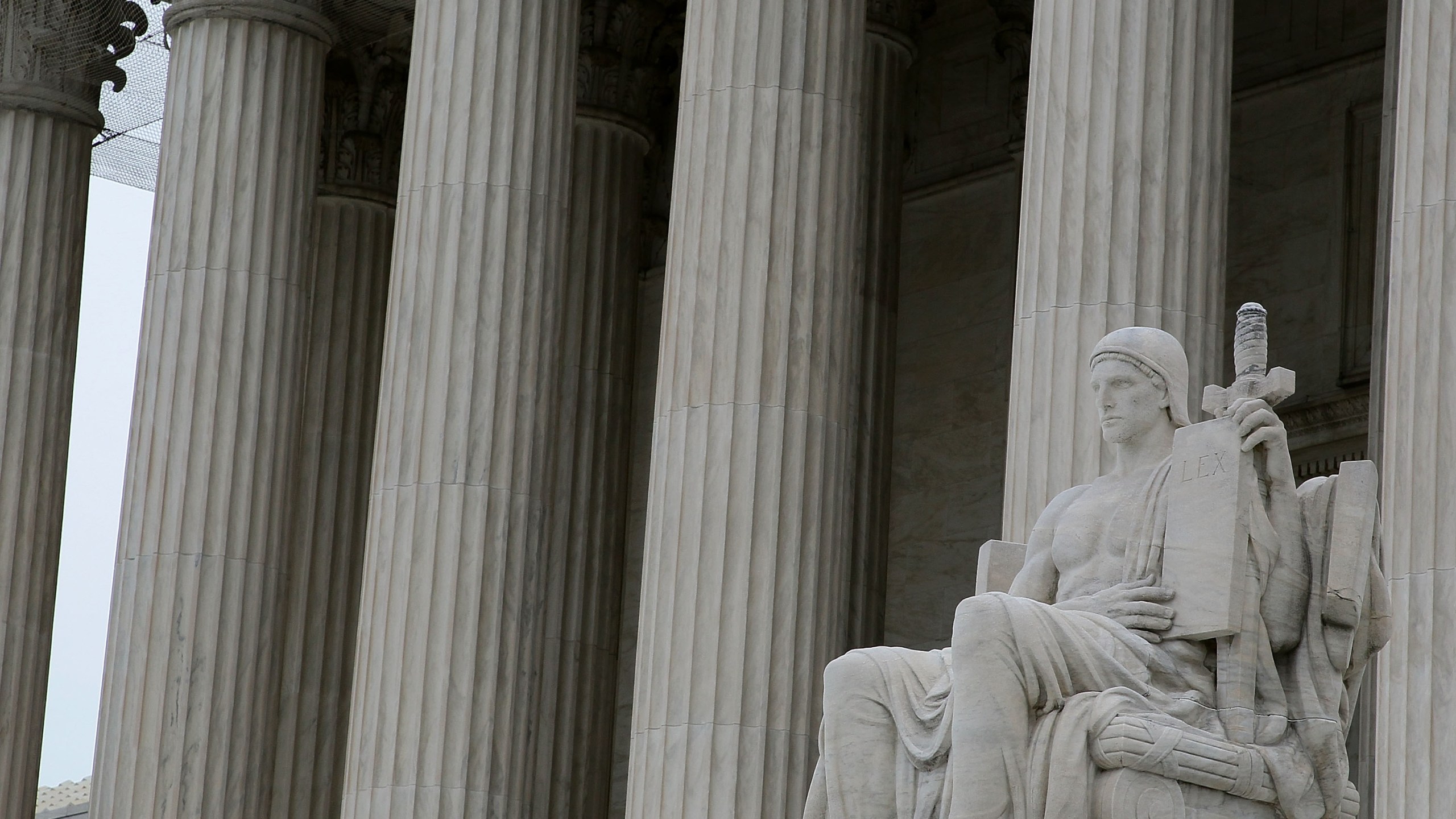 The statue "Authority of Law" by artist James Earle Fraser is seen outside the U.S. Supreme Court Building on March 2, 2010 in Washington, DC. (Mark Wilson/Getty Images)