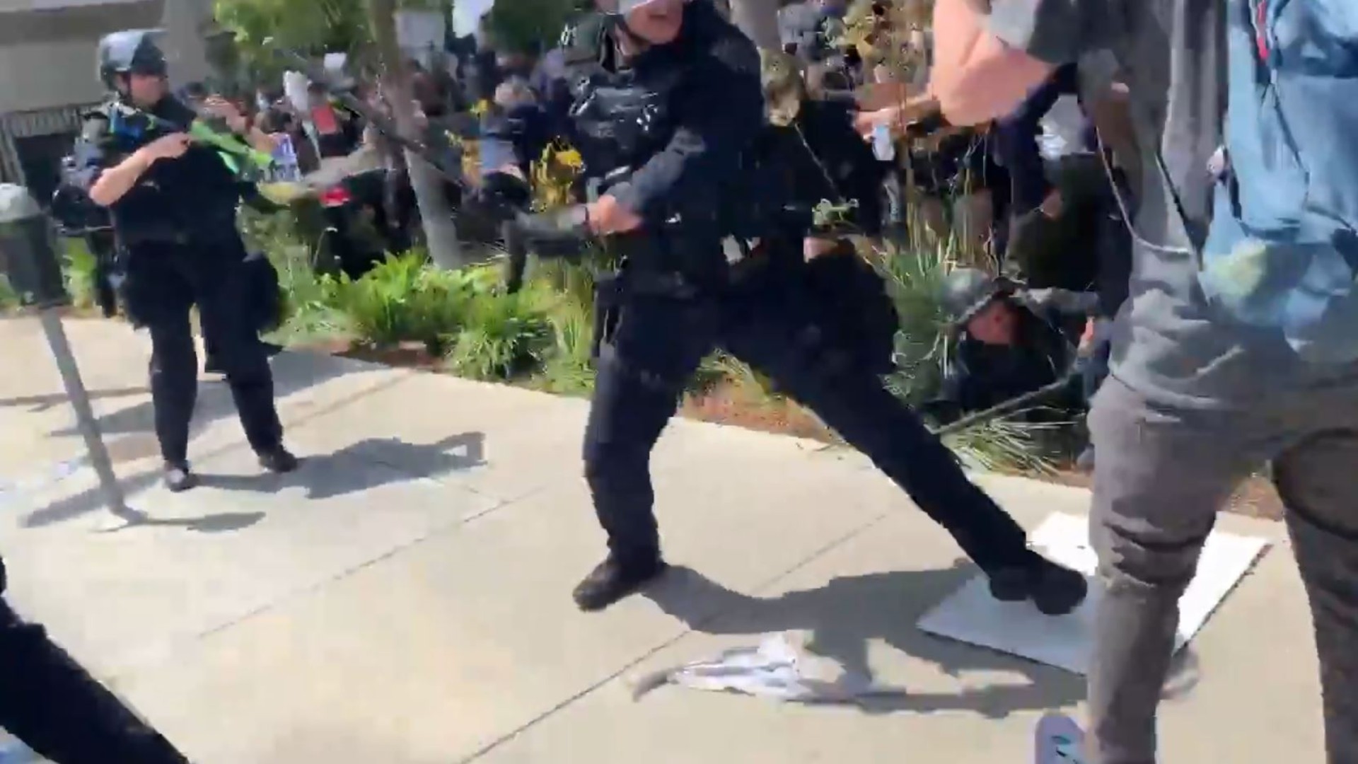 A Los Angeles Police Department officer strikes a protester with a baton in L.A.'s Fairfax District on May 30, 2020. (Matt McGorry)