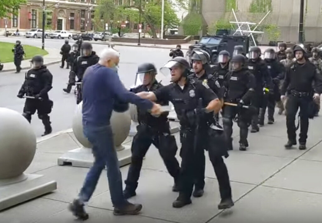 In this image from video provided by WBFO, a Buffalo police officer shoves a man who walked up to police June 4, 2020, in Buffalo, New York.