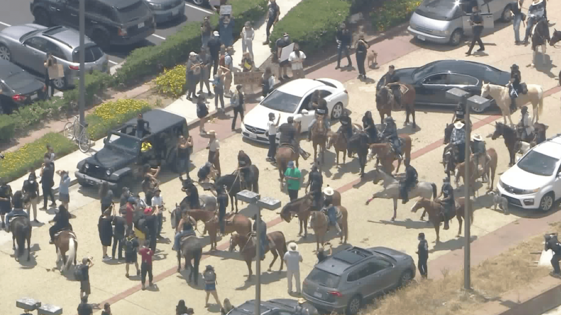 The Compton Cowboys and others take part in a protest against police violence in Compton on June 7, 2020. (Sky5)