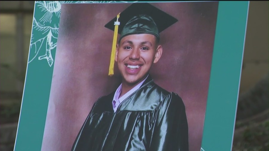 Andres Guardado wears a cap and gown in a photo displayed at a news conference held by his family in downtown Los Angeles on June 30, 2020. (KTLA)