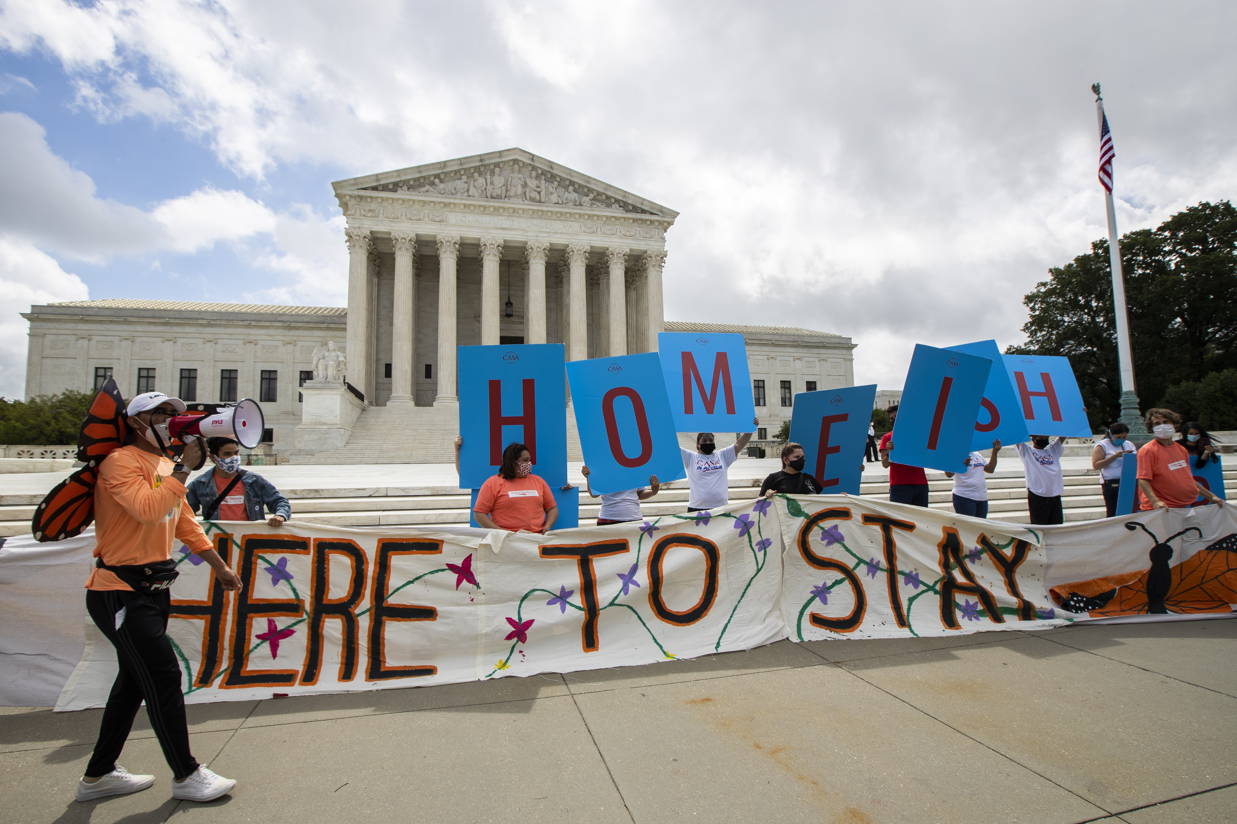 Deferred Action for Childhood Arrivals (DACA) recipient Roberto Martinez, left, celebrates with other DACA recipients in front of the Supreme Court on June 18, 2020, in Washington.(Manuel Balce Ceneta / Associated Press)