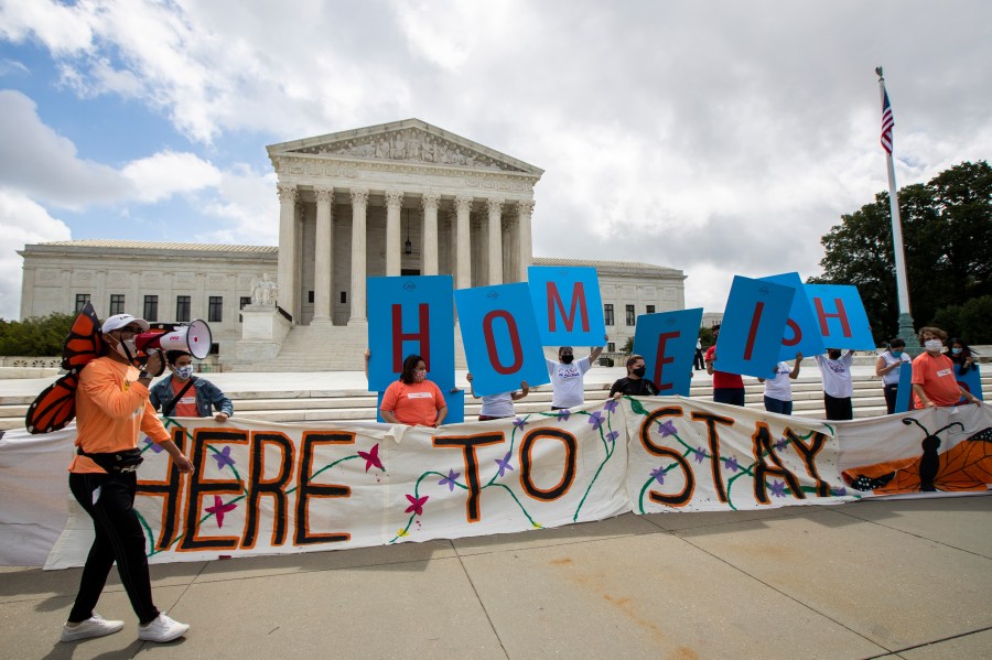 Deferred Action for Childhood Arrivals (DACA) recipient Roberto Martinez, left, celebrates with other DACA recipients in front of the Supreme Court on June 18, 2020, in Washington.(Manuel Balce Ceneta / Associated Press)