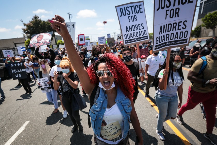 Protesters are seen at a rally for Andres Guardado, a security guard fatally shot by a Los Angeles County sheriff’s deputy. (Jason Armond / Los Angeles Times)