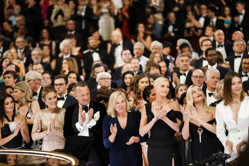 The audience including Rita Wilson, Tom Hanks and Charlize Theron reacts as Renée Zellweger wins the lead actress Oscar for “Judy” at the 92nd Academy Awards in February. (Al Seib/Los Angeles Times)