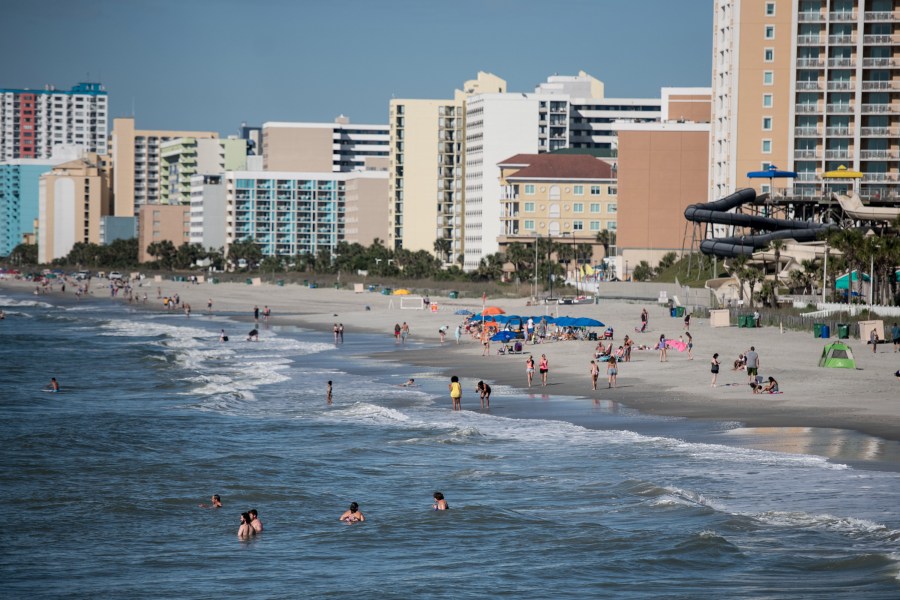 People wade in the surf on the morning of May 23, 2020 in Myrtle Beach, South Carolina. (Sean Rayford/Getty Images)