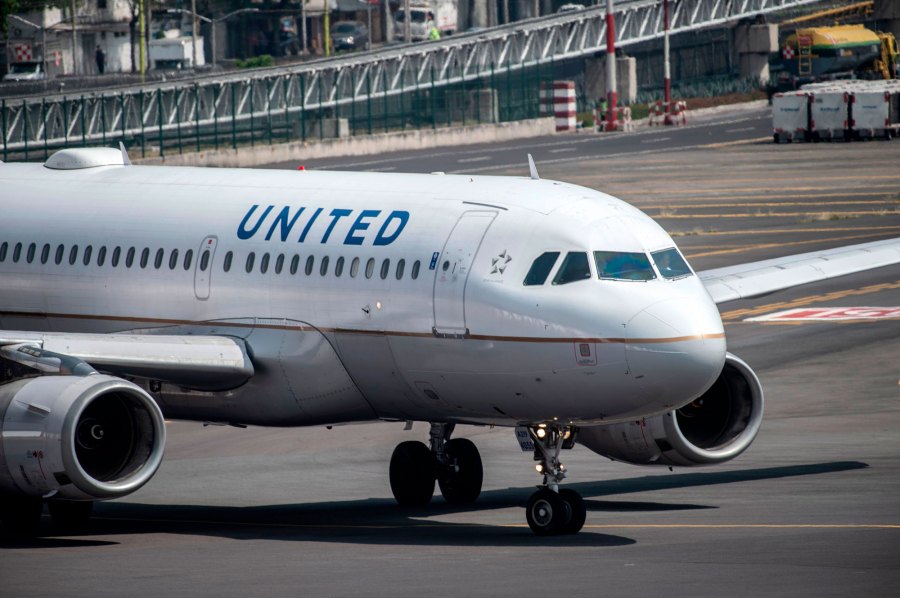 A United Airlines plane prepares to take off at the Benito Juarez International airport in Mexico City, on March 20, 2020. (PEDRO PARDO/AFP via Getty Images)