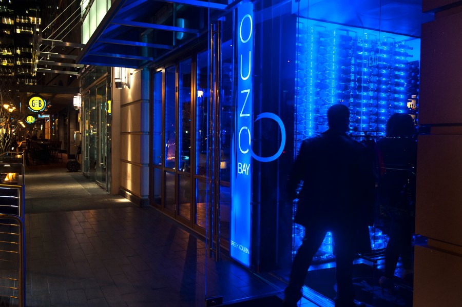 Patrons enter Ouzo Bay Greek Kouzina, a newish Greek Restaurant in Harbor East, Wednesday February 14, 2013 in Baltimore, Maryland. (Katherine Frey/The Washington Post via Getty Images)