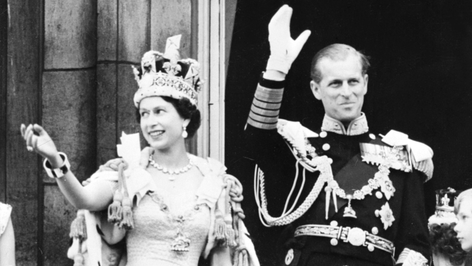 Britain's Queen Elizabeth II (L) accompanied by Britain's Prince Philip, Duke of Edinburgh (R) waves to the crowd, June 2, 1953 after being crowned at Westminter Abbey in London. (AFP via Getty Images)