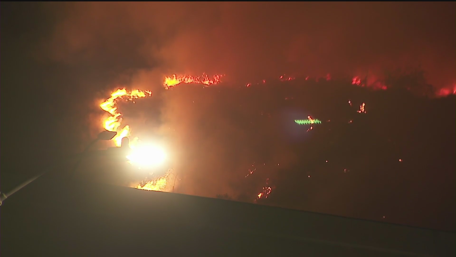 Firefighters respond to a brush fire in the Bel-Air area on June 10, 2020. (KTLA)