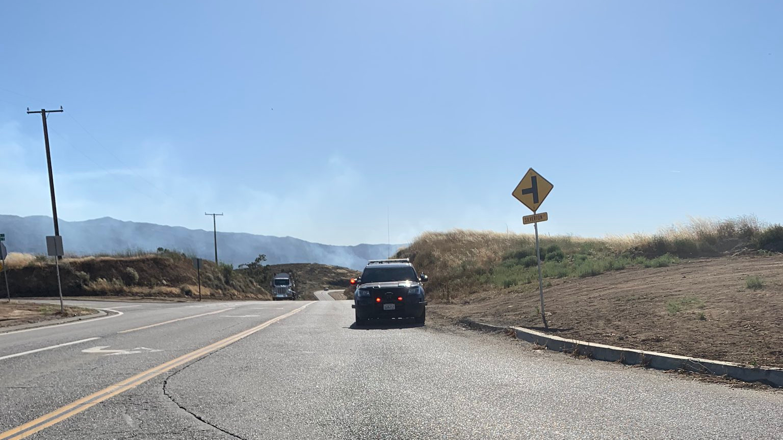 Crews respond to a brush fire spreading rapidly near Corona on June 8, 2020, in a photo provided by the California Highway Patrol.