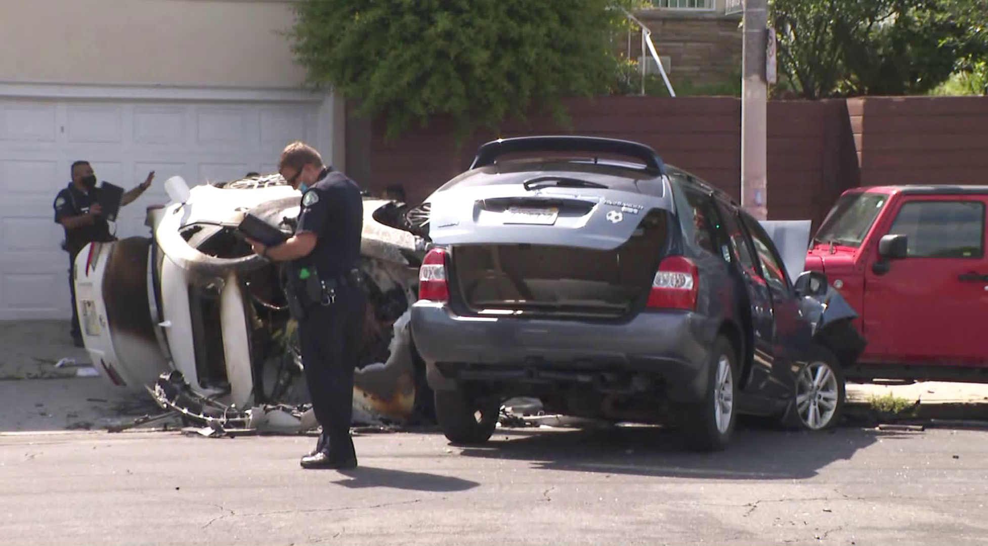 LAPD officials investigate a crash scene in the Westlake District on June 12, 2020. (KTLA)