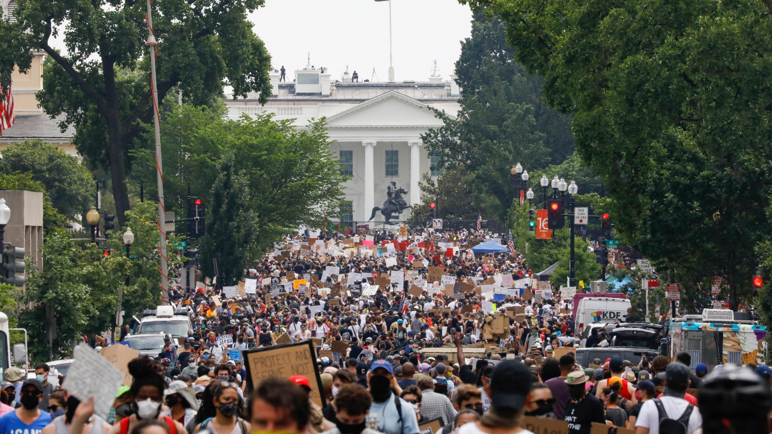 In this Saturday, June 6, 2020 file photo, demonstrators gather near the White House in Washington, to protest the death of George Floyd, a black man who was in police custody in Minneapolis. Public health experts say there is little evidence that the protests that erupted after Floyd’s death caused a significant increase in coronavirus infections. If the protests had driven an explosion in cases, experts say, the jumps would have started to become apparent within two weeks — and perhaps as early as five days. (AP Photo/Jacquelyn Martin)