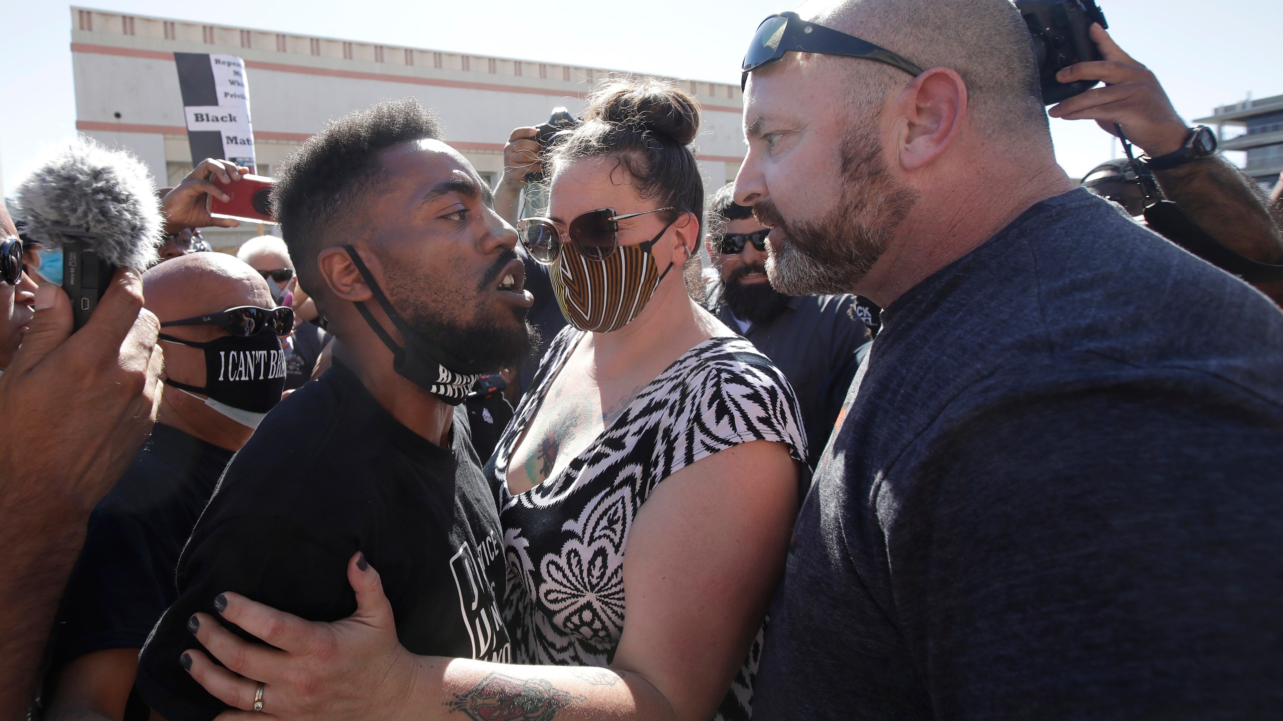 Two people confront each other during a protest calling for an end to racial injustice in Martinez on July 12, 2020. (AP Photo/Jeff Chiu)