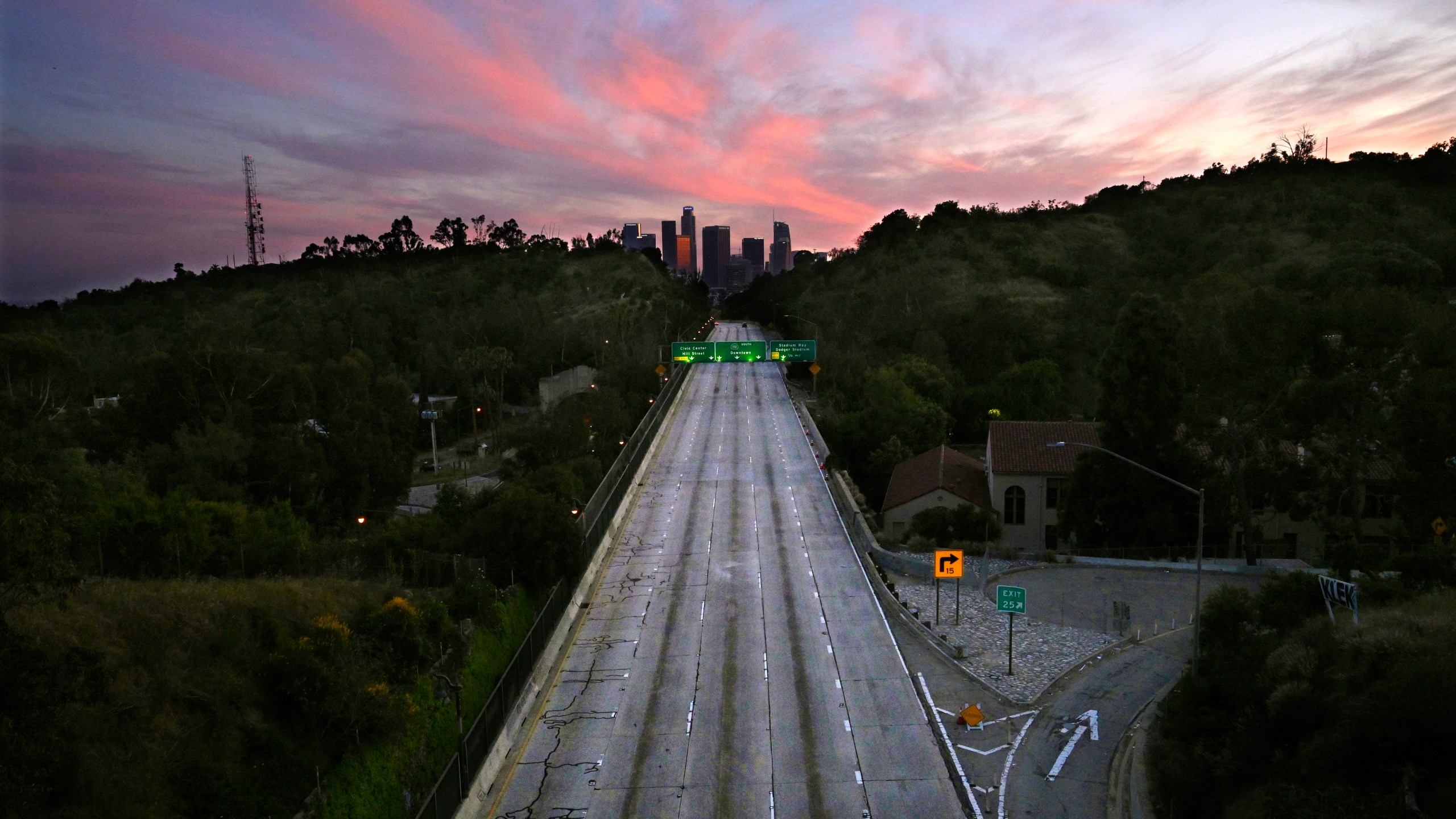 This April 26, 2020 file photo shows empty lanes of the 110 Arroyo Seco Parkway that leads to downtown Los Angeles during the coronavirus outbreak in Los Angeles. A record drop in U.S. energy consumption this spring was driven by less demand for coal that's burned for electricity and oil that's refined into gasoline and jet fuel. (AP Photo/Mark J. Terrill, File)