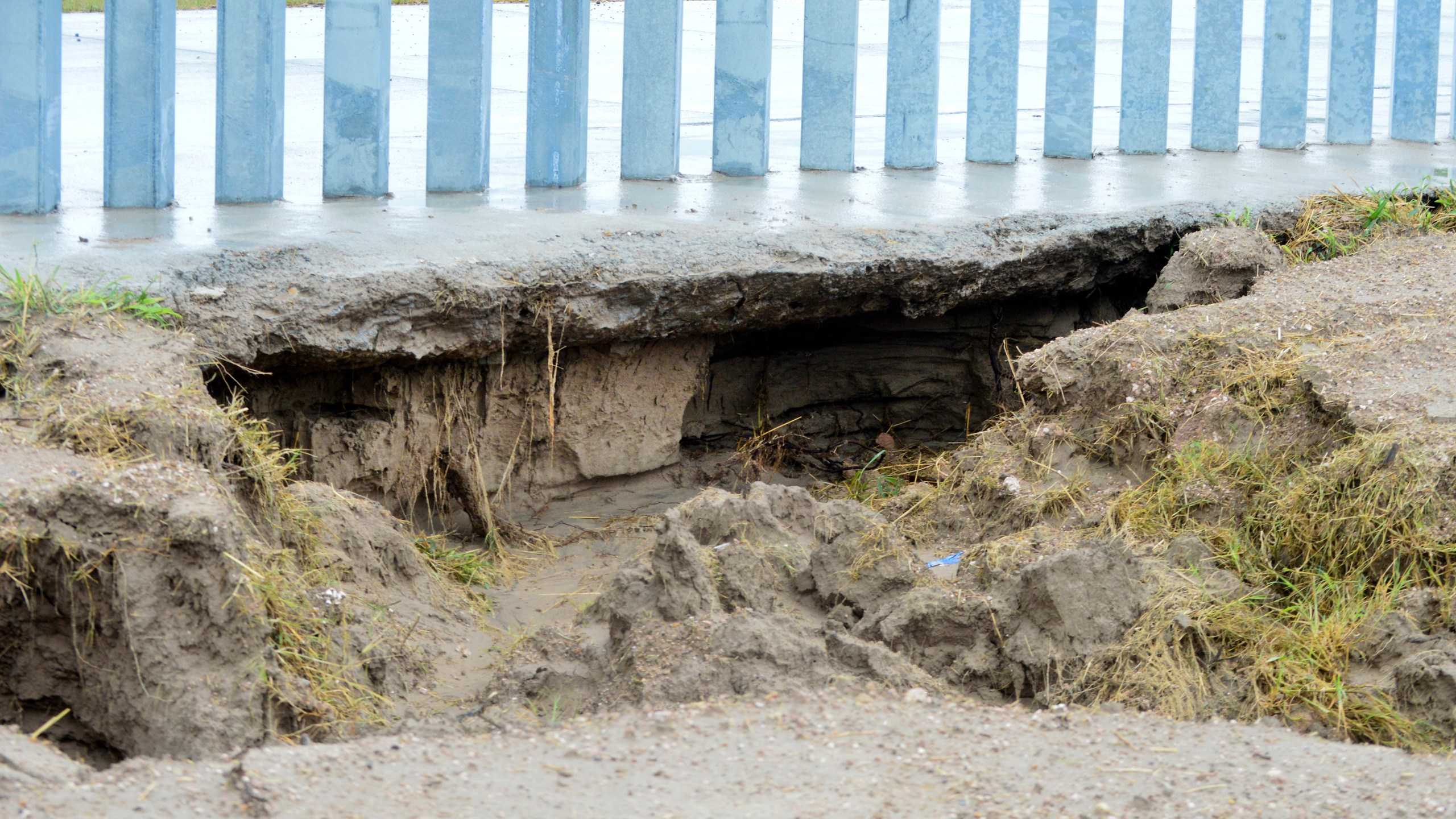 This July 26, 2020 photo provided by the National Butterfly Center shows damage caused by Tropical Storm Hanna at the Fisher border wall, a privately funded border fence on the Rio Grande River near Mission, Texas. The wall was built by a construction company that's won $1.3 billion in U.S. government contracts and promoted by supporters of President Donald Trump. (The National Butterfly Center via AP)