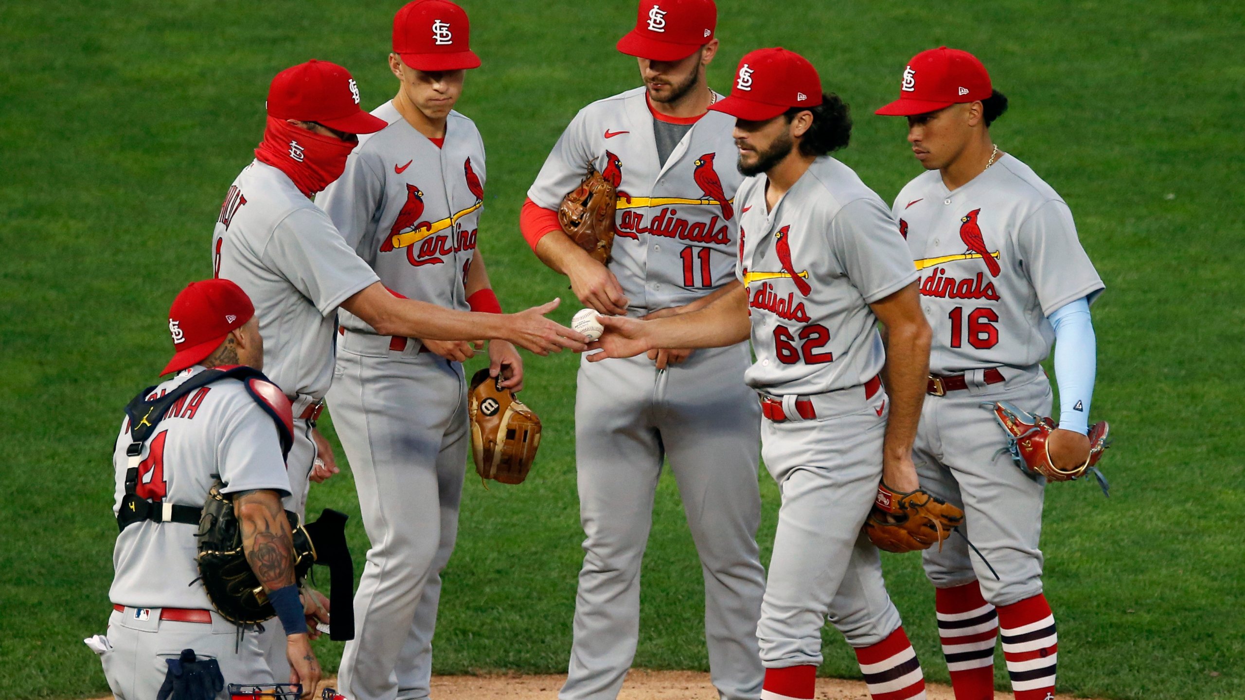 St. Louis Cardinals pitcher Daniel Ponce de Leon hands the ball over to manager Mike Shildt, left, after being pulled in the fifth inning of the team's baseball game against the Minnesota Twins on Wednesday, July 29, 2020, in Minneapolis. (AP Photo/Jim Mone)